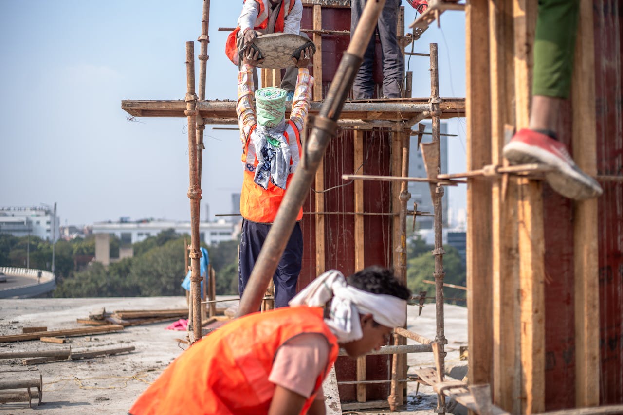 The Art of Drawing Readers In: Your attractive post title goes here Team of construction workers building a high-rise in Delhi, India.